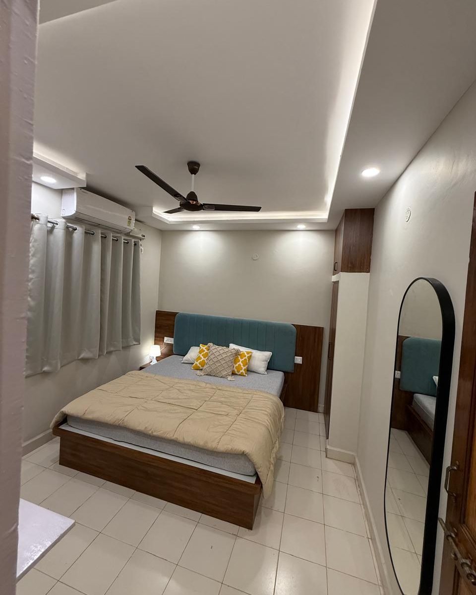 Bedroom with a full length mirror