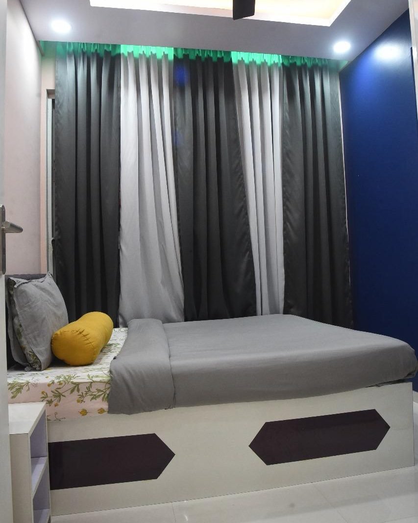 Bedroom with a blue feature wall