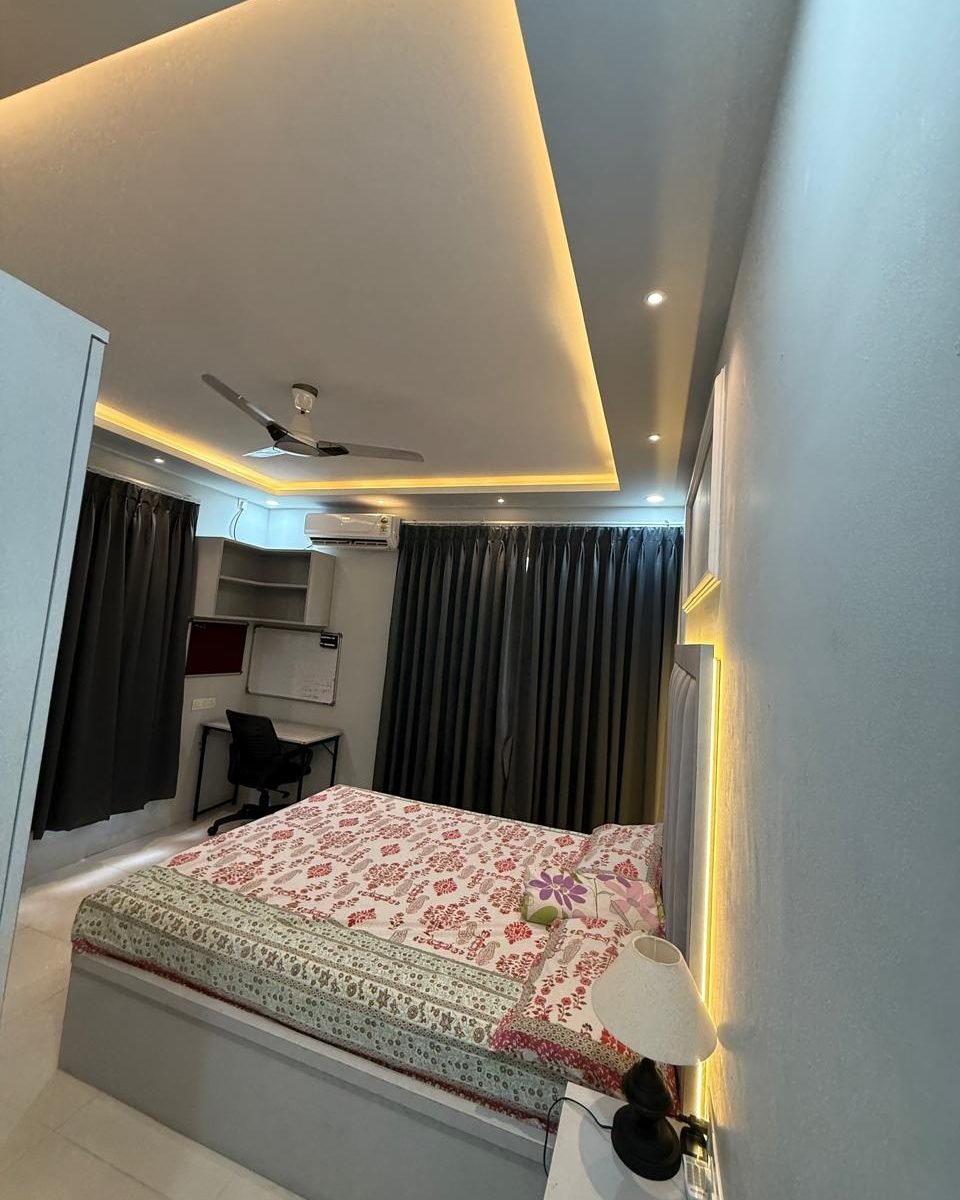 Bedroom with a cove lit false ceiling