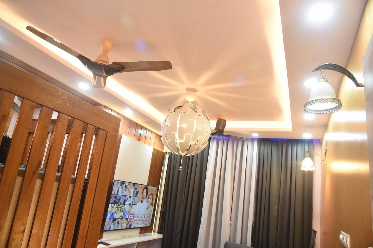Living room with a wood ceiling and pendants